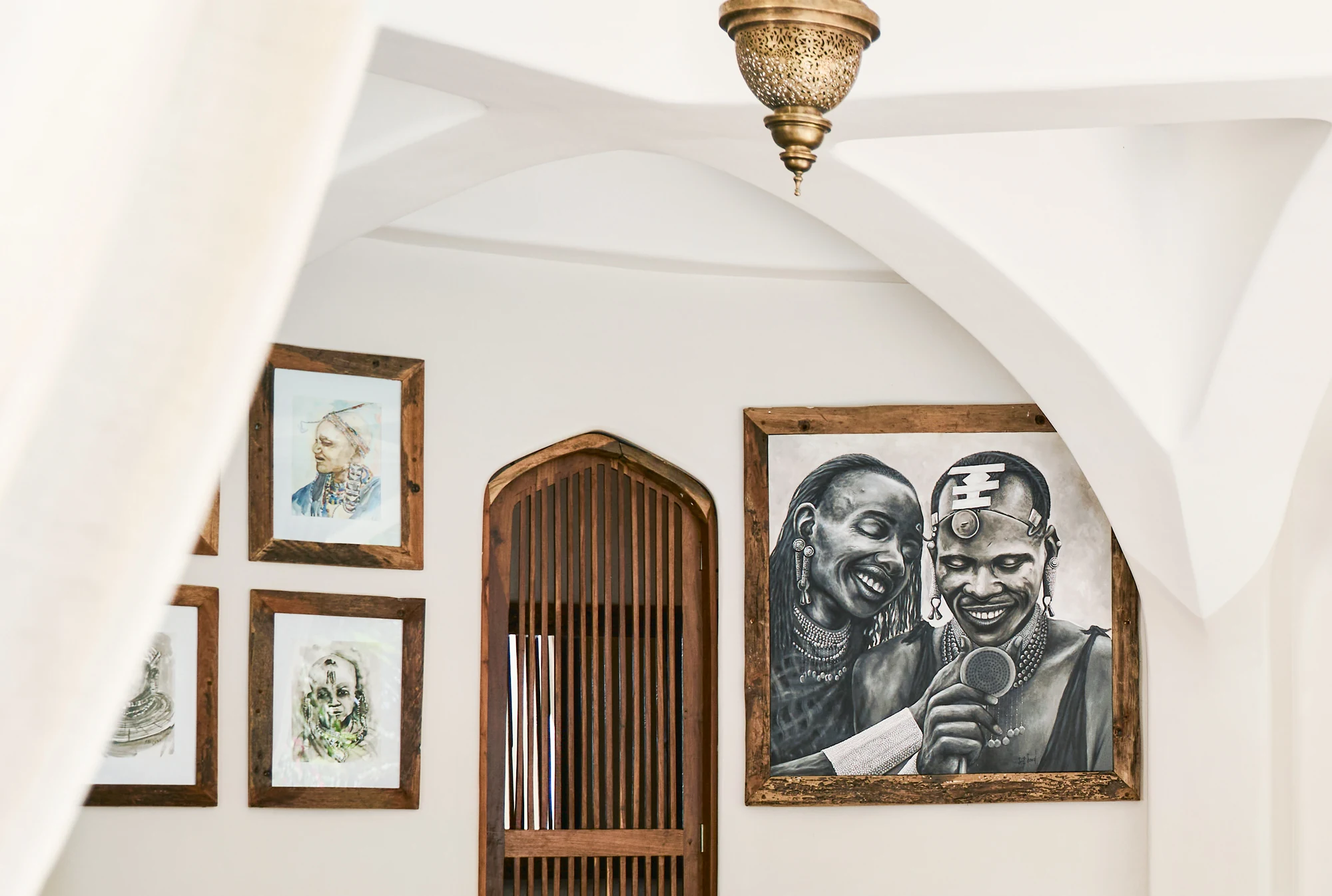 Zanzibar villa interior featuring East African portrait art