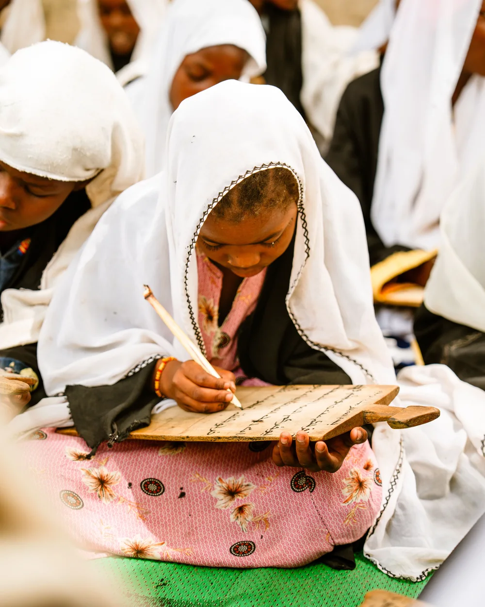 A child writing during a learning activity