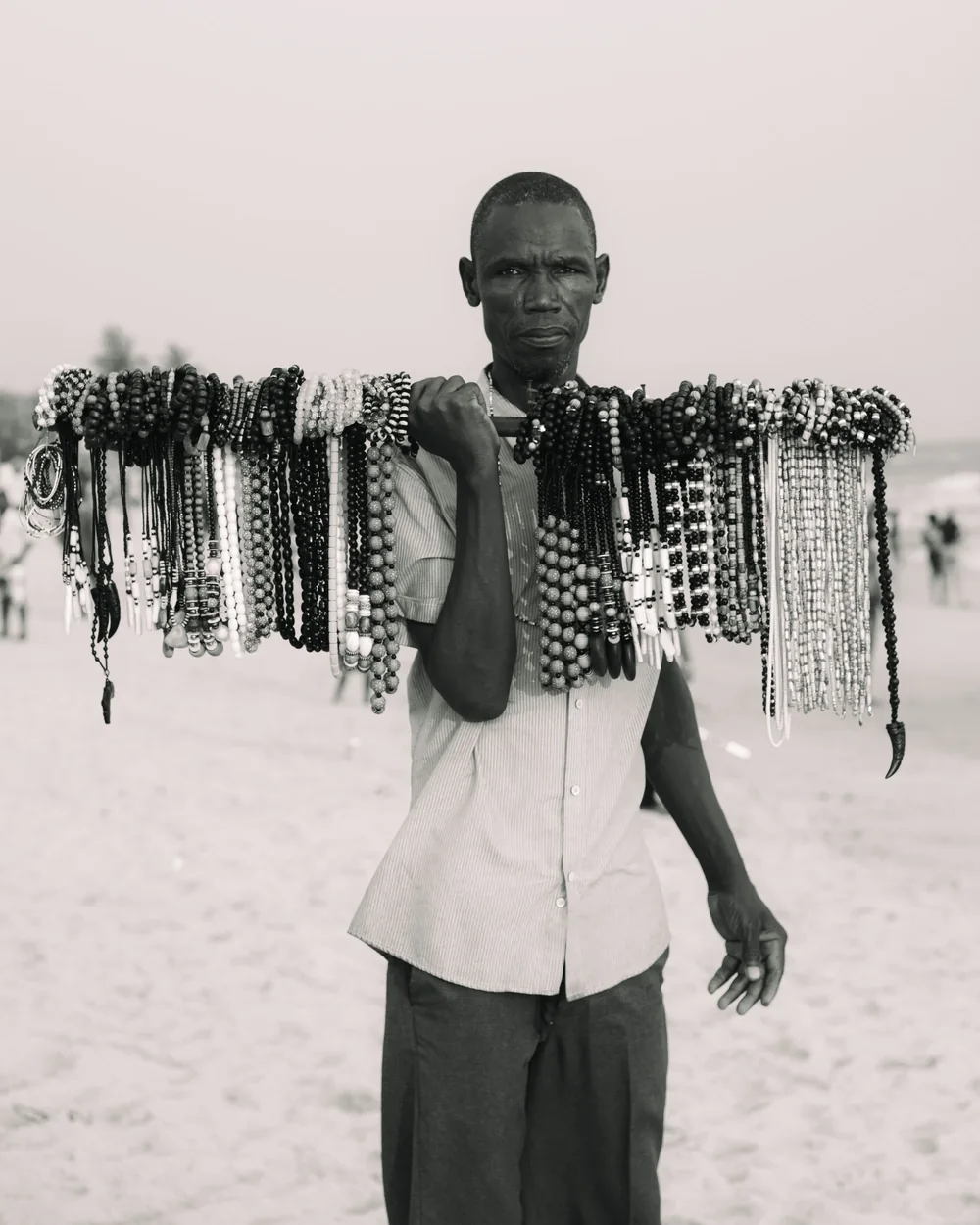 A Zanzibar artisan presenting handmade beadwork